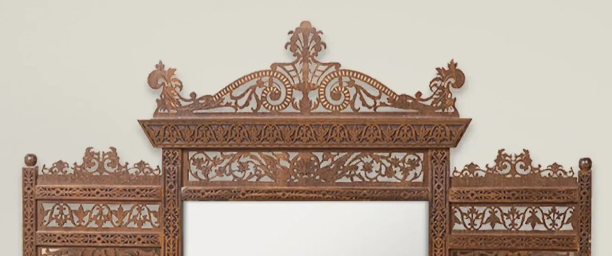 Tarquin carved mirror with shelves – close-up of the hand-carved crown