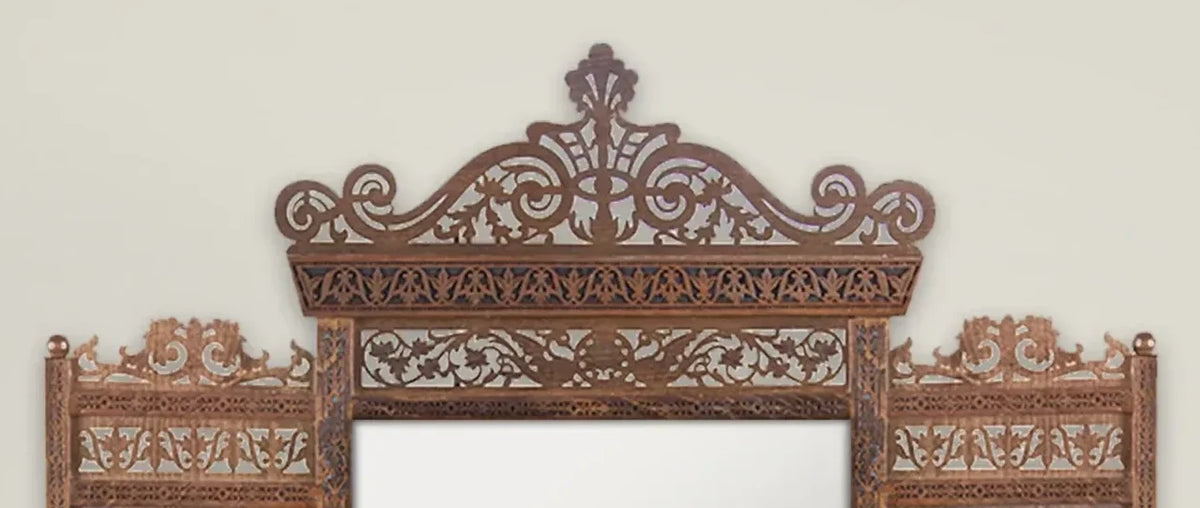 Tarquin Grande carved mirror with shelves – close-up of the hand-carved crown