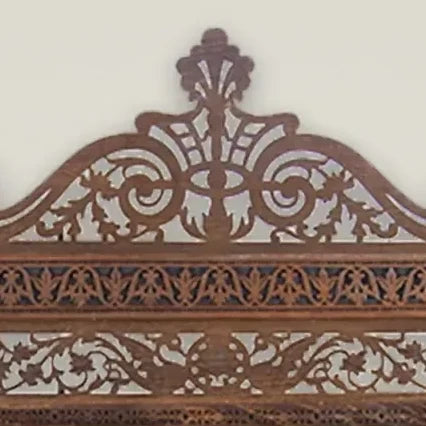 Tarquin Grande carved mirror with shelves – detail of the carved crown centre